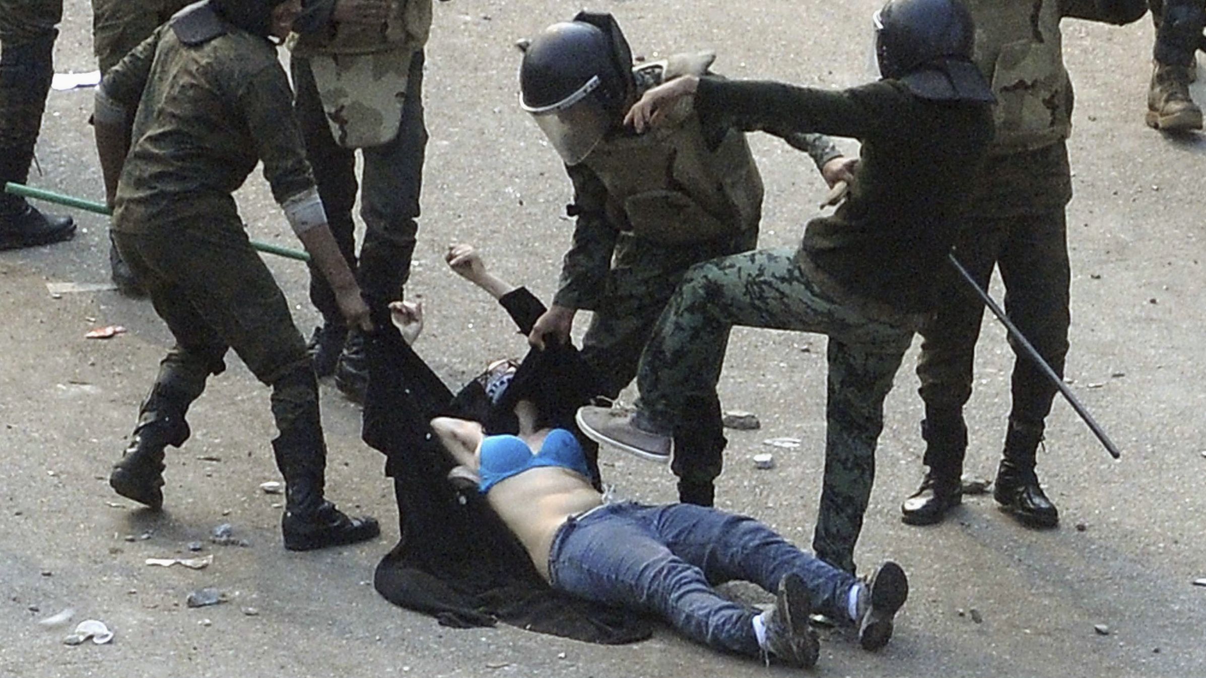 Egyptian soldiers arrest a protester during deadly clashes in Cairo's Tahrir Square in December 2011. Images of the protester being stomped <a href="https://www.cnn.com/2011/12/19/world/meast/egypt-unrest/index.html" target="_blank">stoked anger among the pro-democracy demonstrators battling Egyptian security.</a> Tahrir Square was the symbolic center of the uprising that brought down President Hosni Mubarak earlier in the year.
