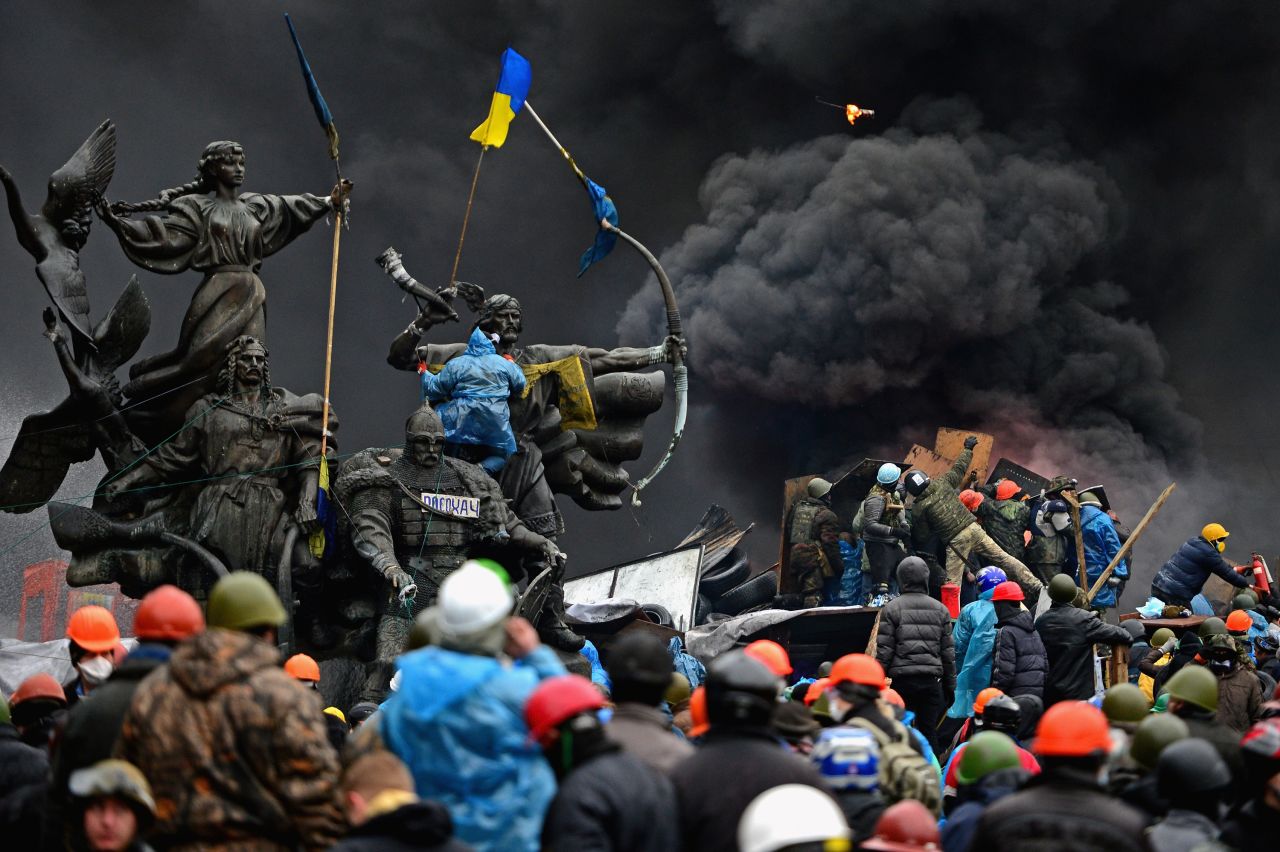 Anti-government protesters clash with police in Kiev, Ukraine, in February 2014. Kiev's Independence Square had been the center of anti-government protests since November 2013, when President Viktor Yanukovych reversed a decision on a trade deal with the European Union and instead turned toward Russia. <a href="https://www.cnn.com/2014/02/19/world/gallery/ukraine-protests-0218/index.html" target="_blank">The protests</a> soon led to the ouster of Yanukovych and triggered a chain of events that included Russia's annexation of the Crimean Peninsula.
