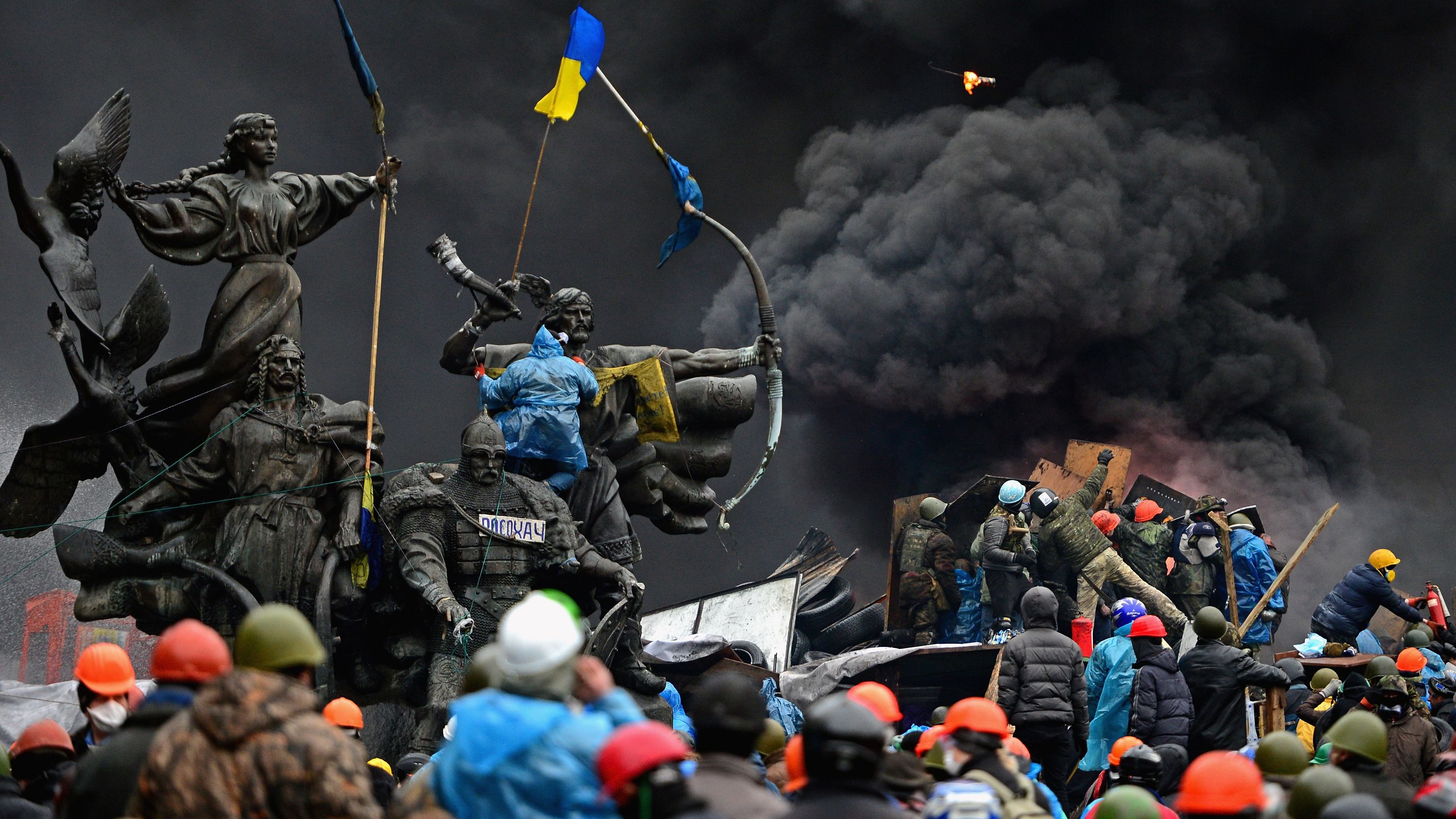 Anti-government protesters clash with police in Kiev, Ukraine, in February 2014. Kiev's Independence Square had been the center of anti-government protests since November 2013, when President Viktor Yanukovych reversed a decision on a trade deal with the European Union and instead turned toward Russia. <a href="https://www.cnn.com/2014/02/19/world/gallery/ukraine-protests-0218/index.html" target="_blank">The protests</a> soon led to the ouster of Yanukovych and triggered a chain of events that included Russia's annexation of the Crimean Peninsula.