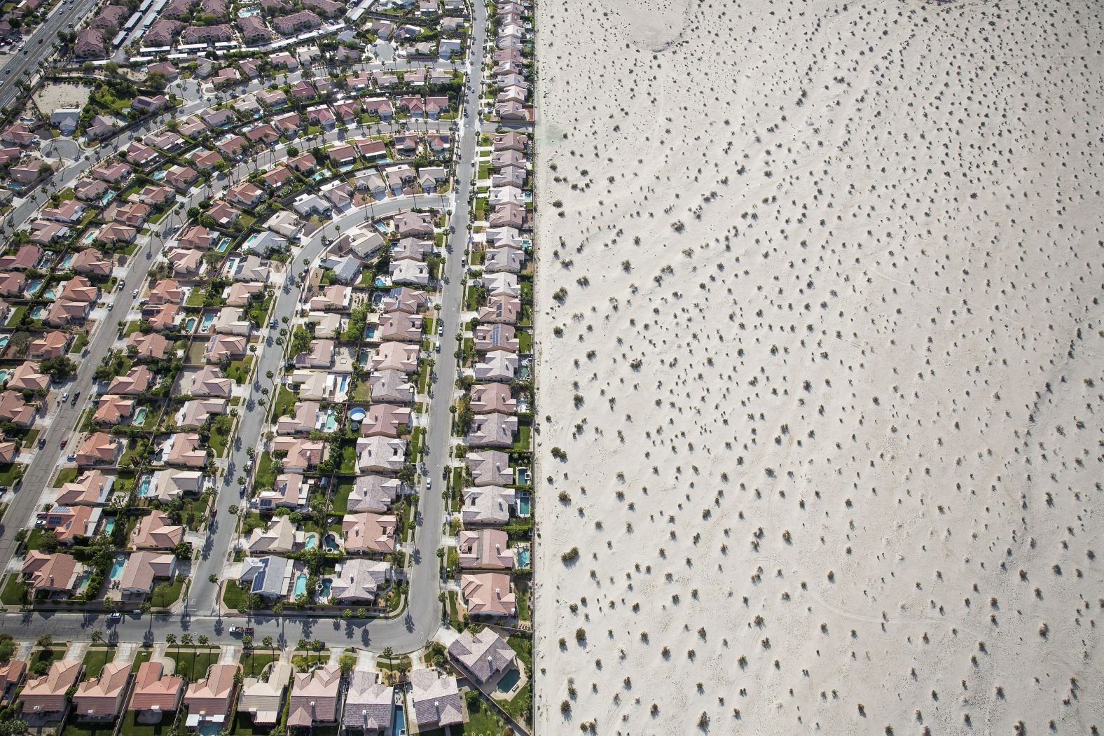 In this aerial photo, taken in April 2015, a housing development meets the edge of undeveloped desert in Cathedral City, California. California Gov. Jerry Brown imposed mandatory water restrictions on residents, businesses and farms in <a href="http://www.cnn.com/2014/07/17/us/gallery/california-drought/index.html" target="_blank">the drought-ravaged state,</a> ordering cities and towns to reduce their usage by 25%.