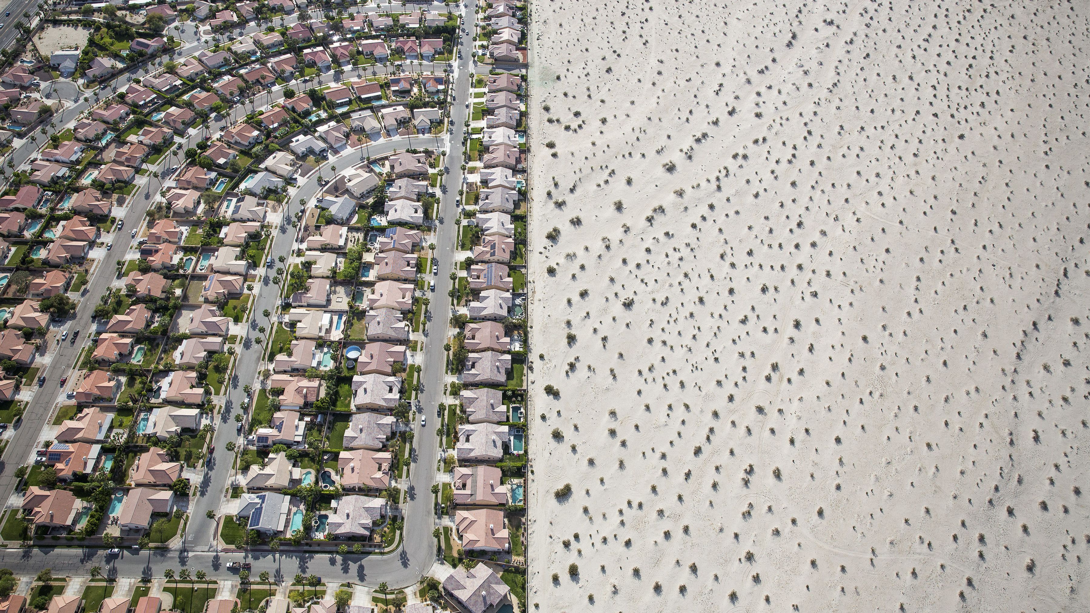 In this aerial photo, taken in April 2015, a housing development meets the edge of undeveloped desert in Cathedral City, California. California Gov. Jerry Brown imposed mandatory water restrictions on residents, businesses and farms in <a href="http://www.cnn.com/2014/07/17/us/gallery/california-drought/index.html" target="_blank">the drought-ravaged state,</a> ordering cities and towns to reduce their usage by 25%.