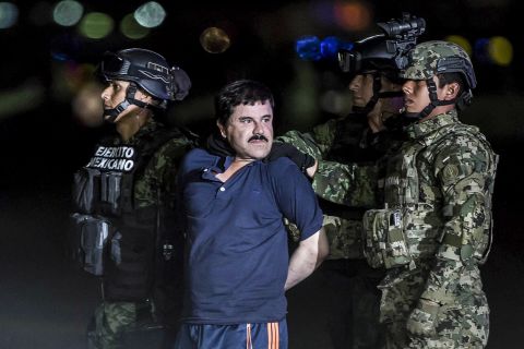 Drug lord Joaquin "El Chapo" Guzman is escorted by soldiers at a federal hangar in Mexico City in January 2016. Members of Mexico's navy <a href="https://www.cnn.com/2016/01/08/americas/el-chapo-captured-mexico/" target="_blank">caught Guzman</a> in an early morning raid in the coastal city of Los Mochis, a senior law enforcement official told CNN. Mexico extradited Guzman to the United States, where <a href="https://www.cnn.com/2019/02/12/us/el-chapo-guzman-trial-verdict/index.html" target="_blank">he was convicted</a> on all of the federal charges against him.