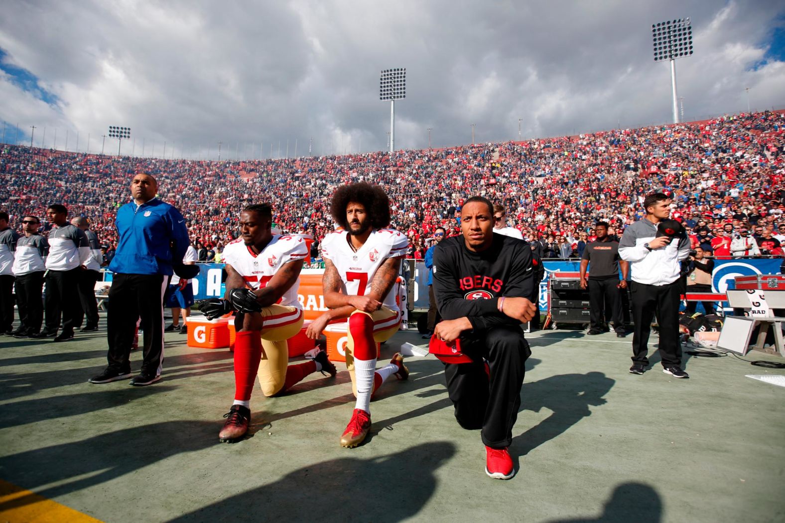 From left, San Francisco 49ers Eli Harold, Colin Kaepernick and Eric Reid kneel during the National Anthem in December 2016. All season, Kaepernick <a href="https://www.cnn.com/2016/09/01/sport/nfl-preseason-49ers-chargers-colin-kaepernick-national-anthem/" target="_blank">refused to stand during the National Anthem</a> because he did not want to "show pride in a flag for a country that oppresses black people and people of color." <a href="https://www.cnn.com/2018/08/09/sport/nfl-national-anthem-preseason-games/index.html" target="_blank">An increasing number of NFL players joined him</a> and began to kneel or raise their fists during the anthem, but critics perceived the protests as unpatriotic and disrespectful of the American flag and US military.