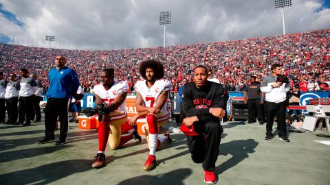 From left, San Francisco 49ers Eli Harold, Colin Kaepernick and Eric Reid kneel during the National Anthem in December 2016. All season, Kaepernick <a href="https://www.cnn.com/2016/09/01/sport/nfl-preseason-49ers-chargers-colin-kaepernick-national-anthem/" target="_blank">refused to stand during the National Anthem</a> because he did not want to "show pride in a flag for a country that oppresses black people and people of color." <a href="https://www.cnn.com/2018/08/09/sport/nfl-national-anthem-preseason-games/index.html" target="_blank">An increasing number of NFL players joined him</a> and began to kneel or raise their fists during the anthem, but critics perceived the protests as unpatriotic and disrespectful of the American flag and US military.