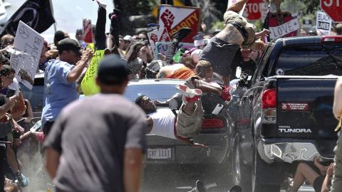 People fly into the air as a vehicle is driven into a group of protesters demonstrating against a white nationalist rally in Charlottesville, Virginia in 2017. 