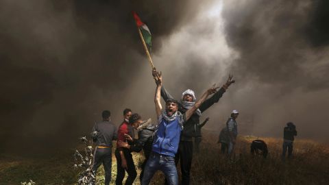 Palestinian protesters shout during <a href="https://www.cnn.com/2018/03/30/middleeast/gaza-protests-intl/index.html" target="_blank">clashes with Israeli troops</a> near the Israel-Gaza border in April 2018. Israeli troops fired live rounds against Palestinians attempting to break through the border fence, the Israeli military said, a week after violence led to the <a href="https://www.cnn.com/2018/04/07/middleeast/gaza-israel-border-protest-deaths-intl/index.html" target="_blank">bloodiest day in Gaza since 2014.</a> On that day, Israeli officials estimated, tens of thousands of Palestinian protesters marched toward the border fence during protests called the March of Return. The goal of those protests, Palestinians say, is to cross the border fence and return to their lands, which became part of Israel seven decades ago.