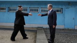PANMUNJOM, SOUTH KOREA - APRIL 27:  North Korean Leader Kim Jong Un (L) and South Korean President Moon Jae-in (R) shake hands over the military demarcation line upon meeting for the Inter-Korean Summit on April 27, 2018 in Panmunjom, South Korea. Kim and Moon meet at the border today for the third-ever inter-Korean summit talks after the 1945 division of the peninsula, and first since 2007 between then President Roh Moo-hyun of South Korea and Leader Kim Jong-il of North Korea.  (Photo by Korea Summit Press Pool/Getty Images)