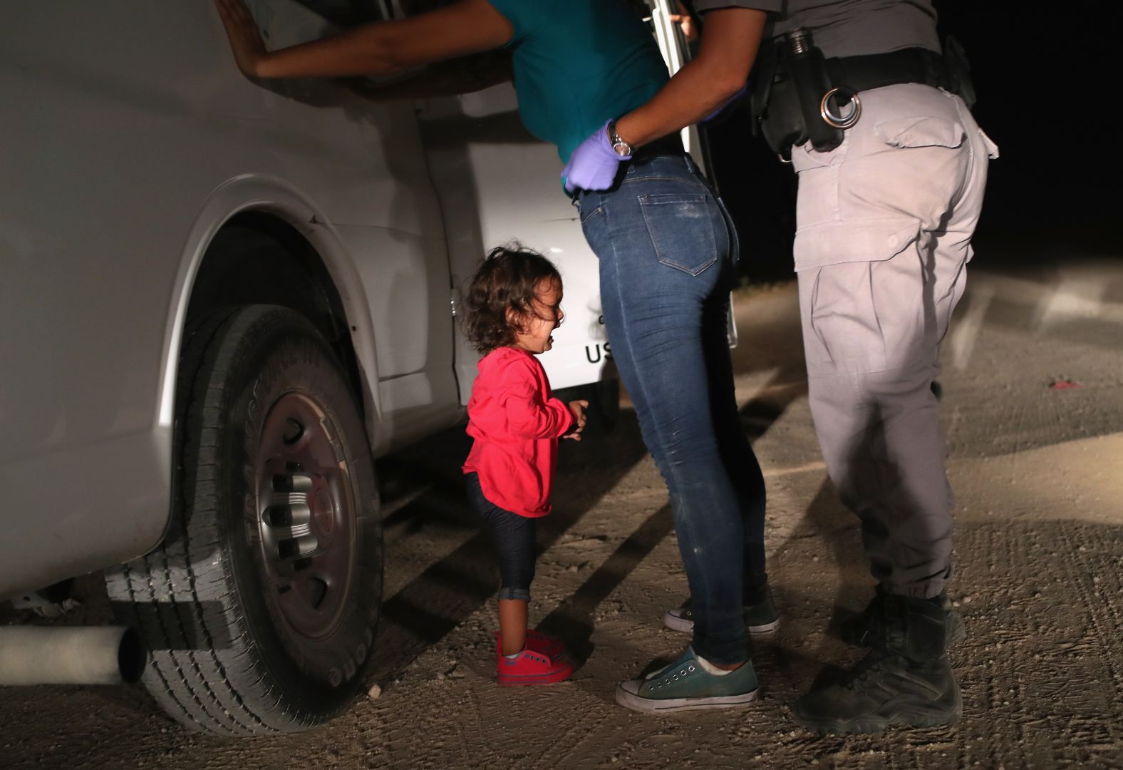 A 2-year-old Honduran girl cries as her mother is searched and detained in McAllen, Texas, near the US-Mexico border in June 2018. They had rafted across the Rio Grande and were stopped by US Border Patrol agents, <a href="https://www.cnn.com/interactive/2018/06/us/crying-girl-john-moore-immigration-cnnphotos/" target="_blank">according to Getty Images photographer John Moore. </a>