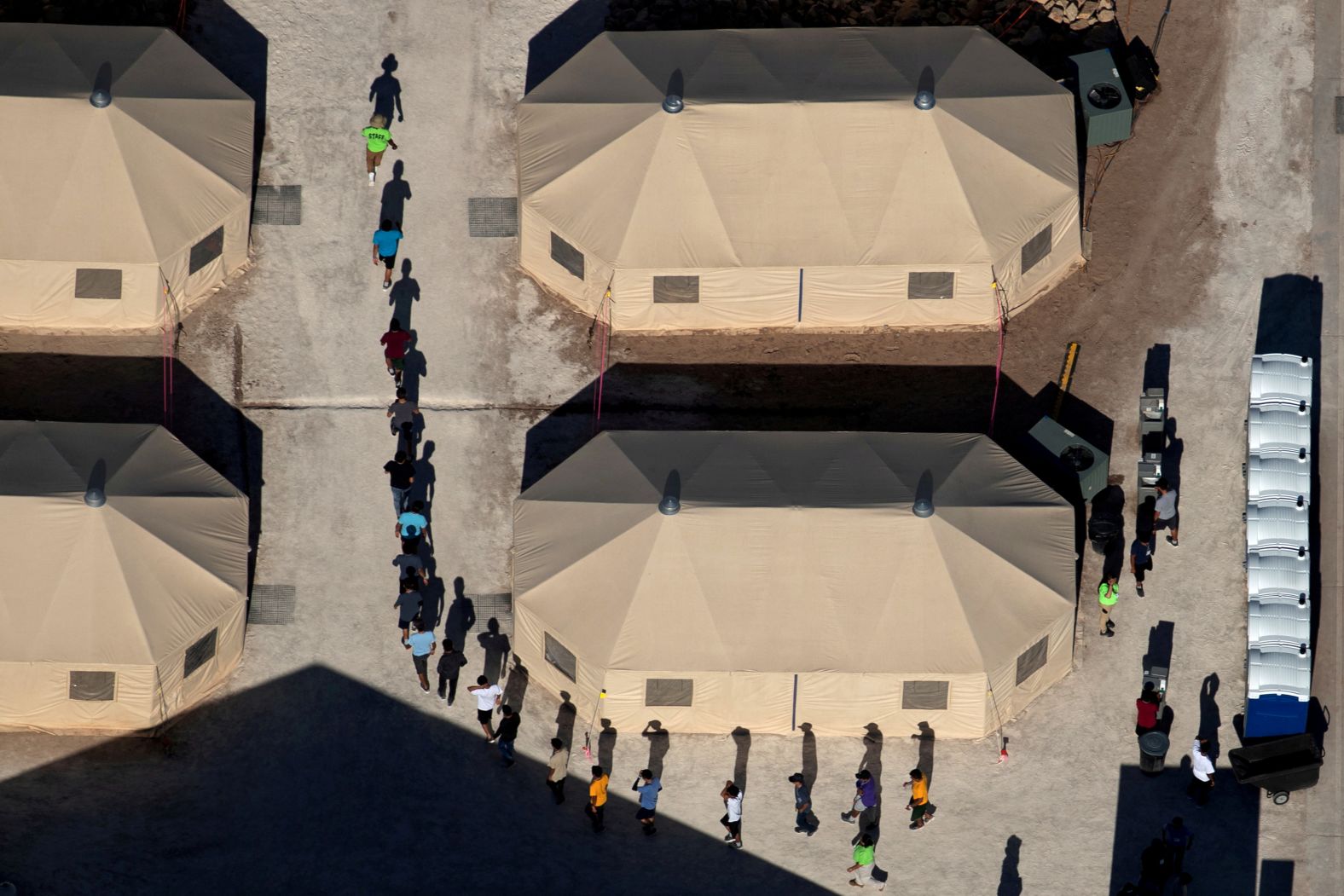 Immigrant children who had been separated from their families walk between tents at a temporary shelter in Tornillo, Texas, in June 2018. Two days later, after facing intense pressure from across the political spectrum, US President Donald Trump <a href="https://www.cnn.com/2018/06/20/politics/trump-separation-action-immigration/index.html" target="_blank">signed an executive order</a> to stop families from being separated at the border. <a href="https://www.cnn.com/2018/06/20/politics/unaccompanied-children-centers/index.html" target="_blank">Related story: A look inside the places where child migrants are held </a>