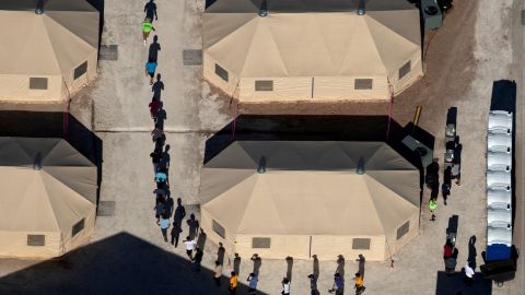 Immigrant children who had been separated from their families walk between tents at a temporary shelter in Tornillo, Texas, in June 2018. Two days later, after facing intense pressure from across the political spectrum, US President Donald Trump <a href="https://www.cnn.com/2018/06/20/politics/trump-separation-action-immigration/index.html" target="_blank">signed an executive order</a> to stop families from being separated at the border. <a href="https://www.cnn.com/2018/06/20/politics/unaccompanied-children-centers/index.html" target="_blank">Related story: A look inside the places where child migrants are held </a>