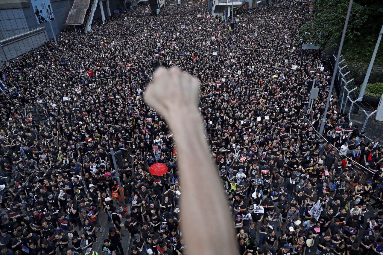 <a href="https://www.cnn.com/2019/06/09/world/gallery/hong-kong-extradition-protest/index.html" target="_blank">People march in the streets of Hong Kong</a> to protest a controversial extradition bill in June 2019. Critics feared the bill would allow citizens to be sent across the border into mainland China. Hong Kong Chief Executive Carrie Lam withdrew the bill on September 4, but she refused to give ground on protesters' four other demands, which include greater democracy for the city and an independent commission into police conduct.