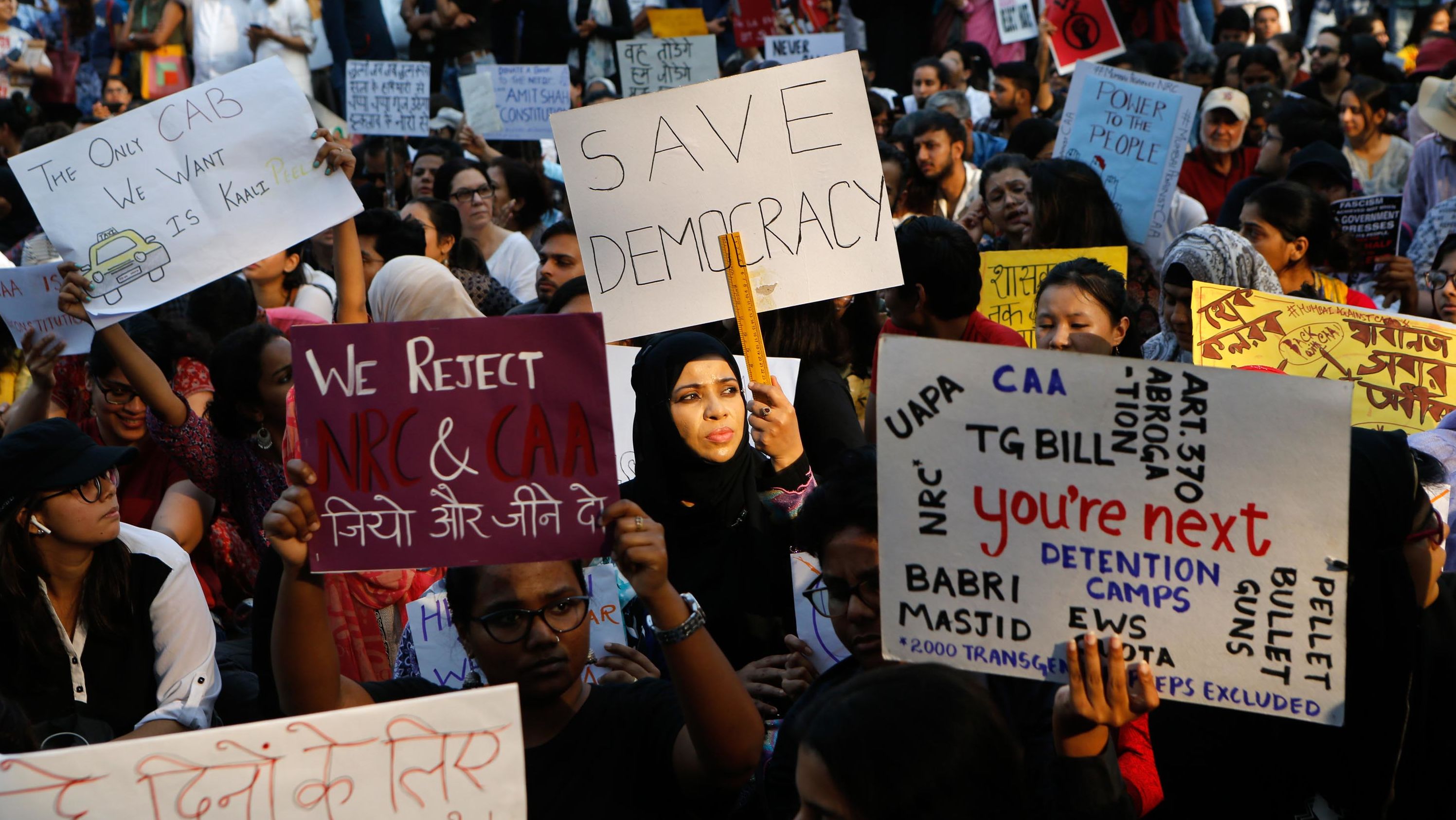 Indians gather during a protest rally in Mumbai on December 19.