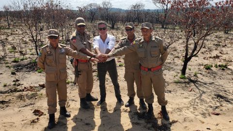 Extreme E founder Alejandro Agag (central) with soldiers in a deforested region of the Amazon.