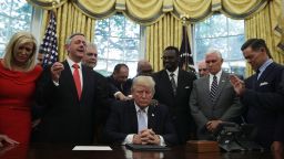 WASHINGTON, DC - SEPTEMBER 01:  U.S. President Donald Trump, Vice President Mike Pence and faith leaders say a prayer during the signing of a proclamation in the Oval Office of the White House September 1, 2017 in Washington, DC. President Trump signed a proclamation to declare this Sunday as a National Day of Prayer for people affected by Hurricane Harvey.  (Photo by Alex Wong/Getty Images)