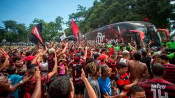 Fans of Flamengo cheer as the bus transporting the team -heading to Qatar for the Club World Cup- arrives at the airport in Rio de Janeiro, Brazil, on December 13, 2019. (Photo by Daniel RAMALHO / AFP) (Photo by DANIEL RAMALHO/AFP via Getty Images)