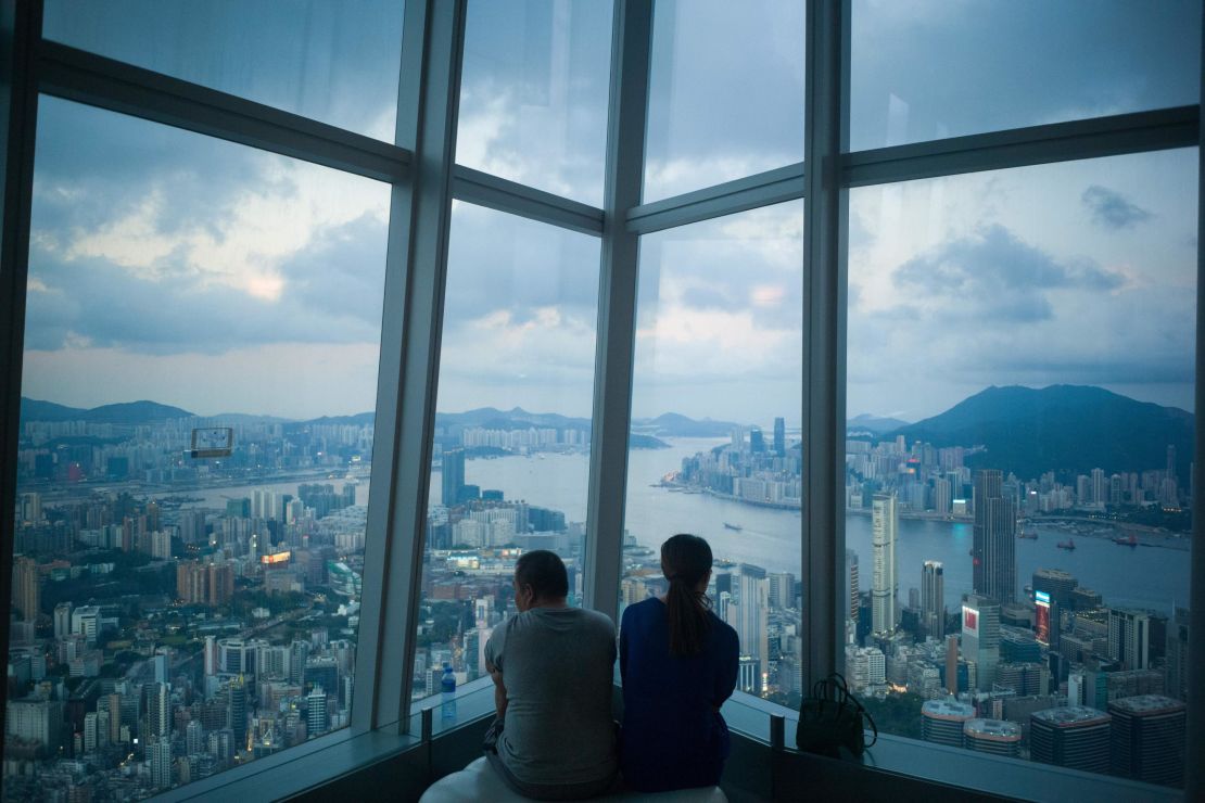 A couple looks at the view of Hong Kong from the International Commerce Centre in 2018. 