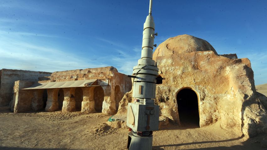 A picture taken on May 2, 2014 shows, amidst desert sand, a film set where numerous Star Wars scenes were filmed in Ong Jmel, in southern Tunisia. The first international meeting of Star Wars fans takes place in Tozeur, in southern Tunisia, until May 4, 2014.  AFP PHOTO / FETHI BELAID        (Photo credit should read FETHI BELAID/AFP via Getty Images)