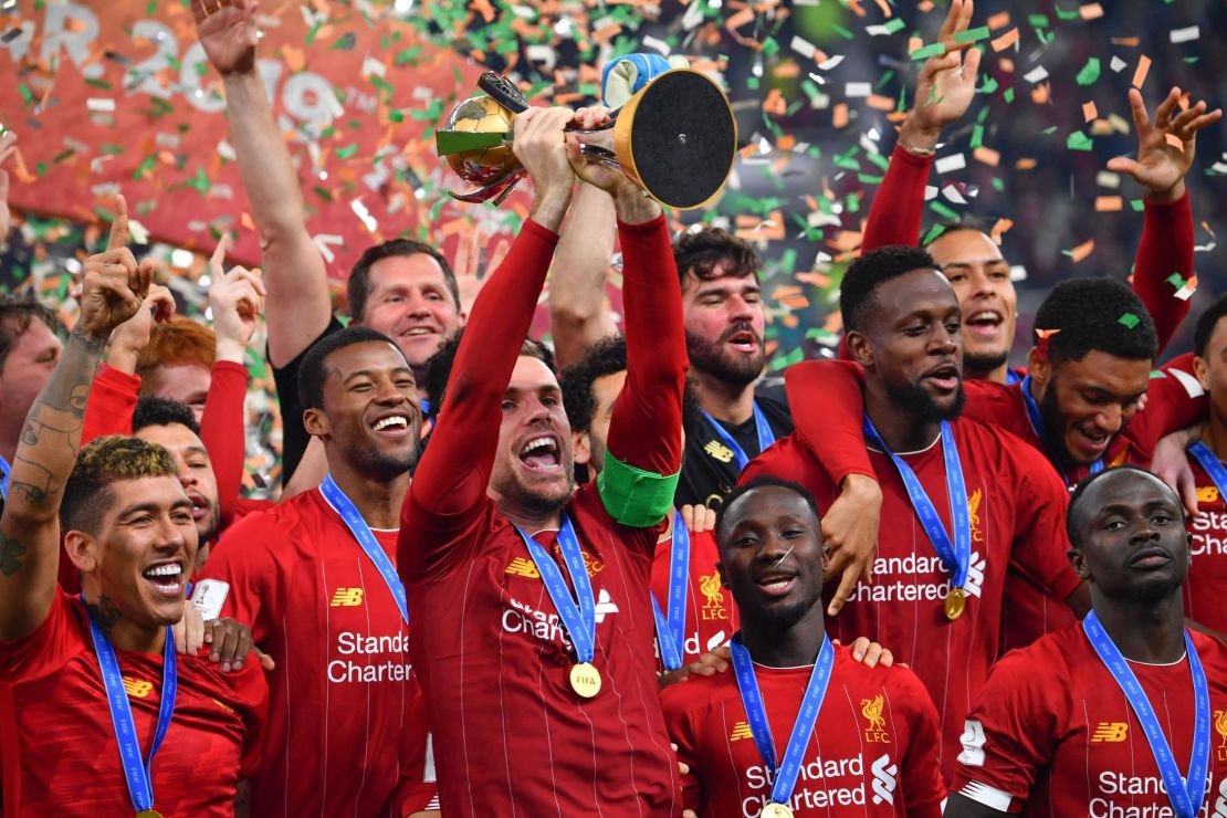 Liverpool captain Jordan Henderson lifts the Club World Cup trophy after his side's 1-0 extra time victory over Flamengo in Qatar.