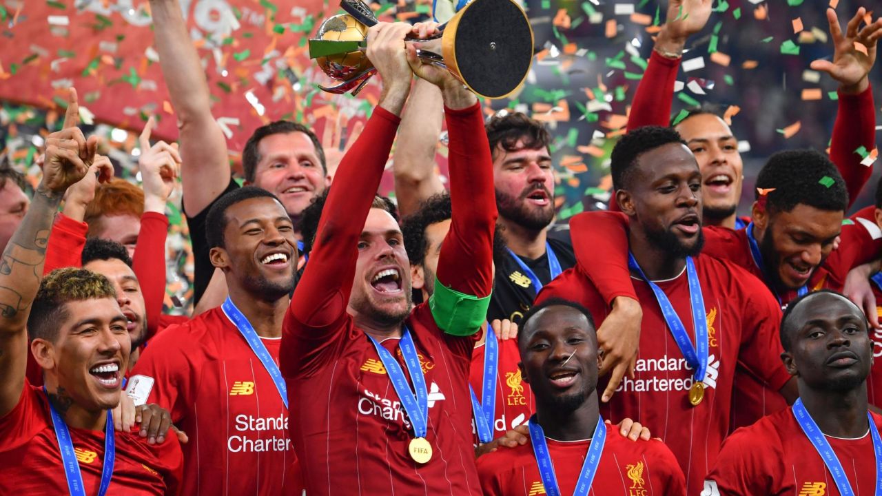Liverpool captain Jordan Henderson lifts the Club World Cup trophy after his side's 1-0 extra time victory over Flamengo in Qatar.