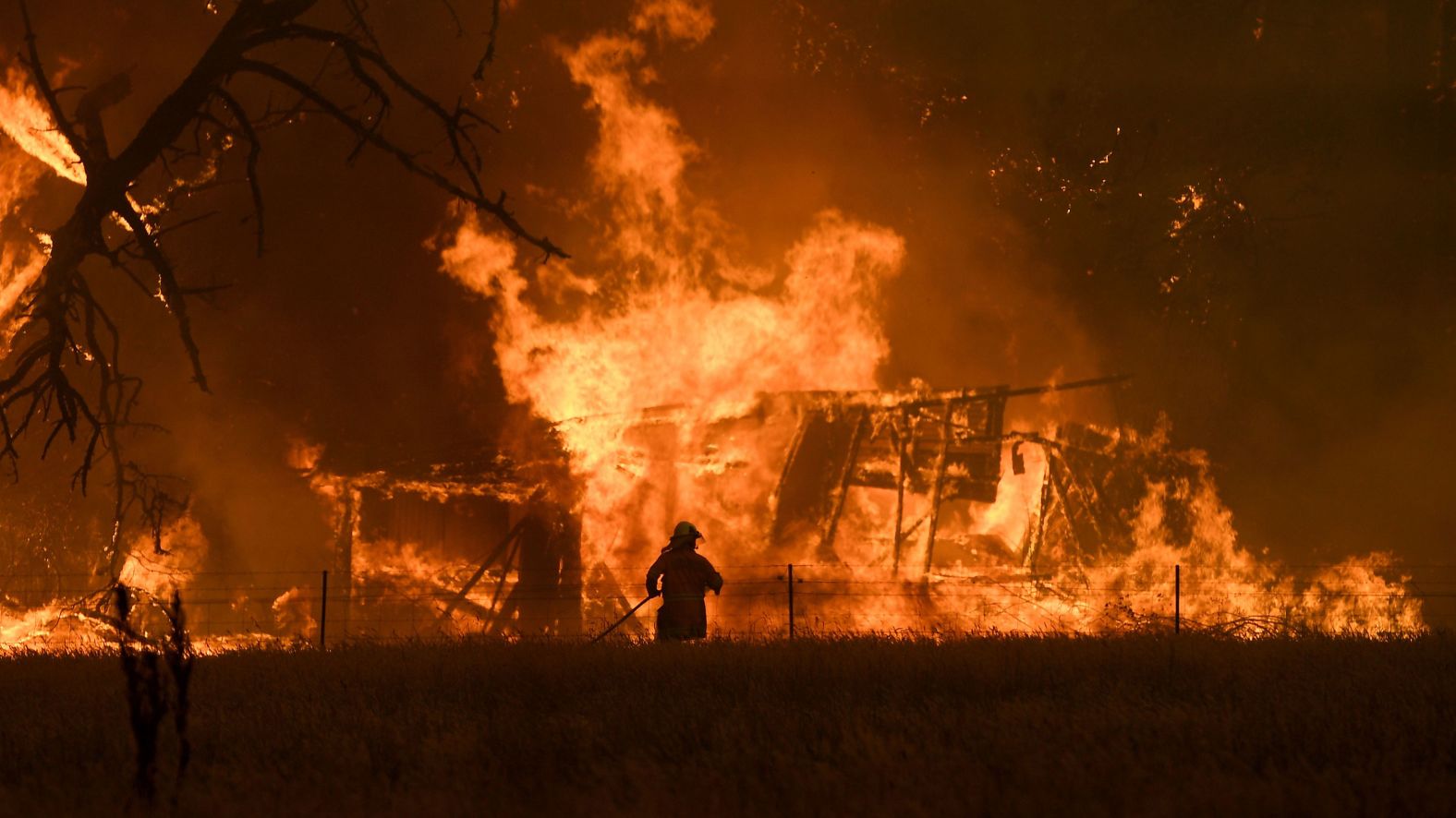 A firefighter battles the Gospers Mountain Fire in Bilpin, New South Wales, on Saturday, December 21.