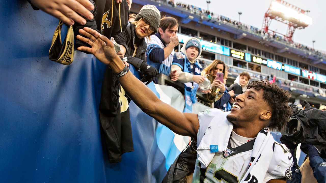 Michael Thomas shakes hands with fans after a game against the Tennessee Titans at Nissan Stadium on December 22, 2019.