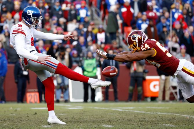 Washington Redskins' Nate Orchard blocks a punt attempt by New York Giants punter Riley Dixon on Sunday, December 22, in Landover, Maryland.