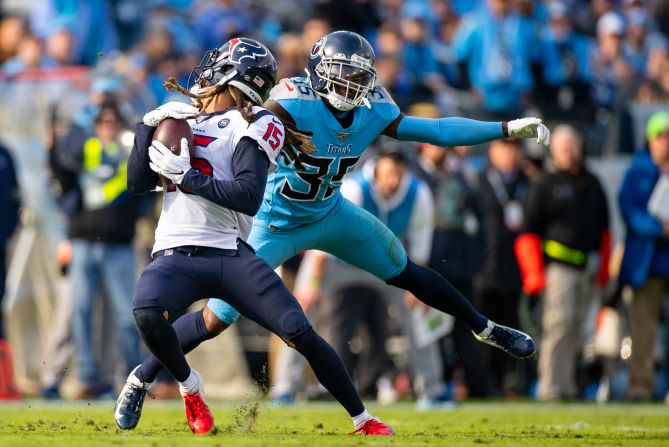 Tennessee Titans' Tramaine Brock tackles Texans' Will Fuller during a game in Nashville on Sunday, December 15. Brock received a facemask penalty following the play.