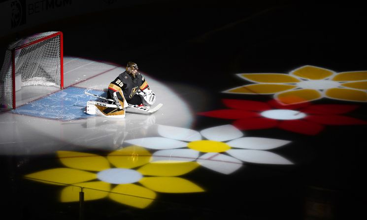 Vegas Golden Knights goalie Marc-Andre Fleury is introduced with flowers before a game against the Minnesota Wild in Las Vegas, Nevada, on Tuesday, December 17. 