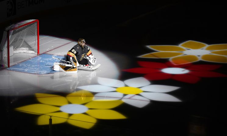 Vegas Golden Knights goalie Marc-Andre Fleury is introduced with flowers before a game against the Minnesota Wild in Las Vegas, Nevada, on Tuesday, December 17.
