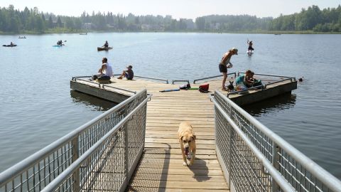 Alaskans who routinely pack knit caps and fleece jackets in summer were swapping them for sunscreen and parasols at DeLong Lake amid a prolonged heatwave.