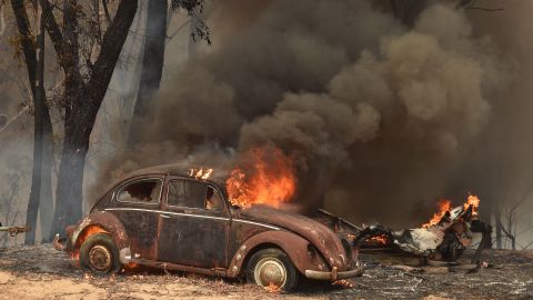 An old Beetle burns from bushfires in Balmoral, 150 kilometres southwest of Sydney.