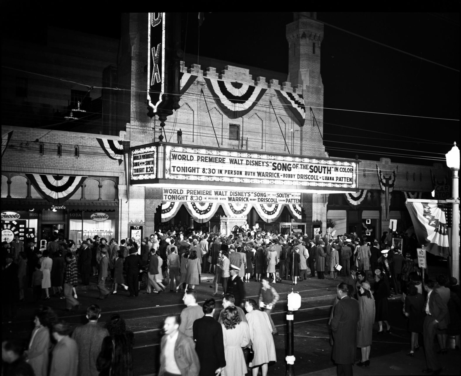 Despite its popularity and beauty, the Fox's grandeur wasn't bullet proof from the Great Depression. And in 1932, only 125 weeks after it opened, William Fox and the theatre were forced to declare bankruptcy, and Fox lost his namesake movie palace. The Fox was auctioned on the courthouse steps and sold to a private company for just $75,000. For the next three decades, the Fox still remained in high demand, showing hundreds of acclaimed films, and evolved into a favorite big band and swing music dance hall. Shown here, moviegoers arrive to watch the premier of Walt Disney's  "Song of the South" in 1946. 
