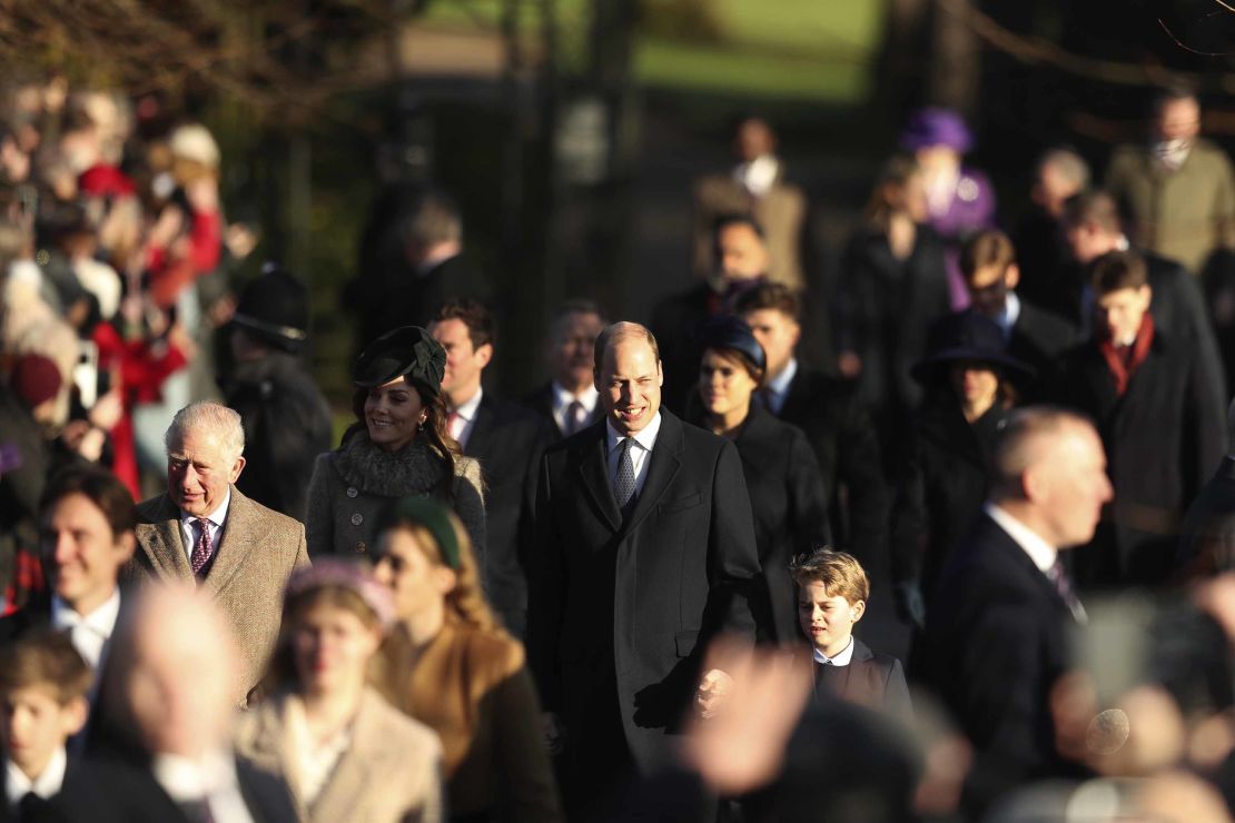 Britain's Prince William, center, and Kate, Duchess of Cambridge, center left, arrive with their son Prince George, center right.