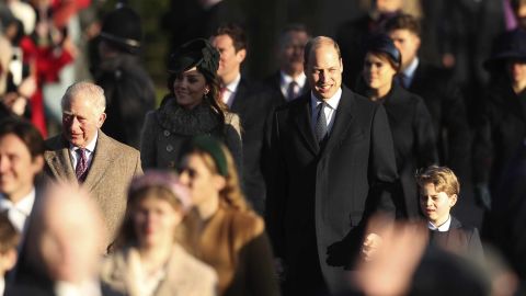 Britain's Prince William, center, and Kate, Duchess of Cambridge, center left, arrive with their son Prince George, center right.