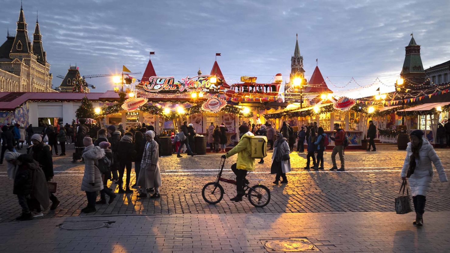 People walk at Holiday's Market on Red Square in Moscow on Friday, December 20. 