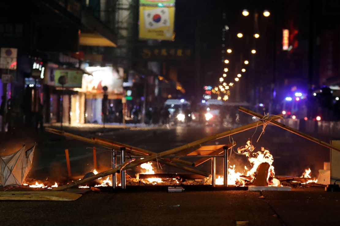 Debris burns on a street during the Christmas holiday in Hong Kong.