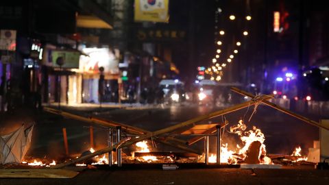 Debris burns on a street during the Christmas holiday in Hong Kong.