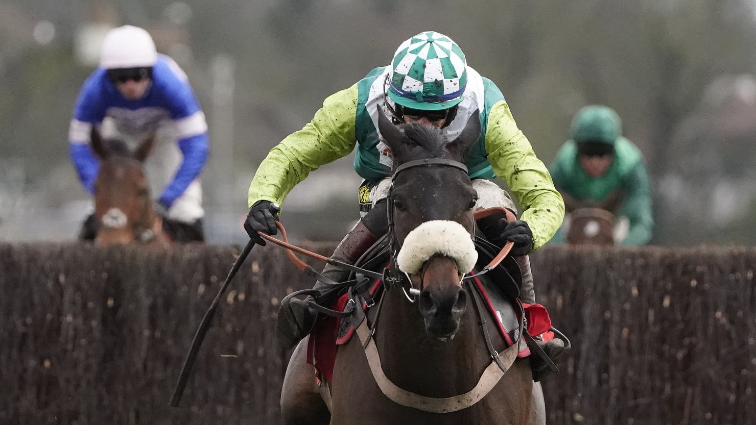 Sam Twiston-Davies pulls clear on Clan Des Obeaux to win the King George VI Chase at Kempton Park from stablemate Cyrname. 