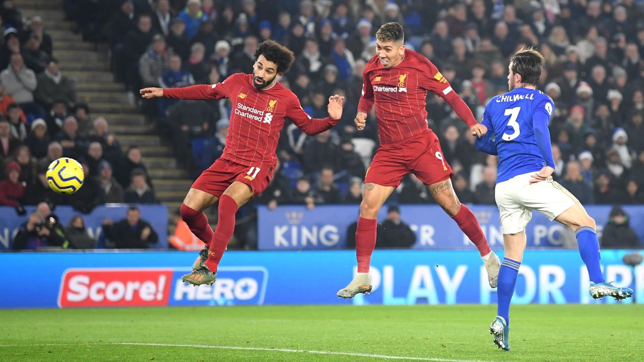 Roberto Firmino heads Liverpool in front in close company with fellow striker Mo Salah in the top of the table clash with Leiceser City at the the King Power Stadium. 