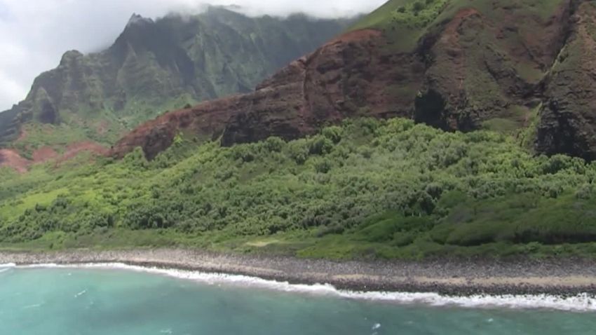 Coast Guard crews are searching by air and in the water for an overdue helicopter with seven people onboard that failed to return from a tour off Kauai's Na Pali coast.