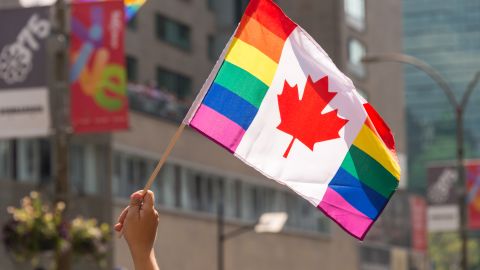 A Canadian rainbow flag is raised at the 2017 Montreal gay pride parade.