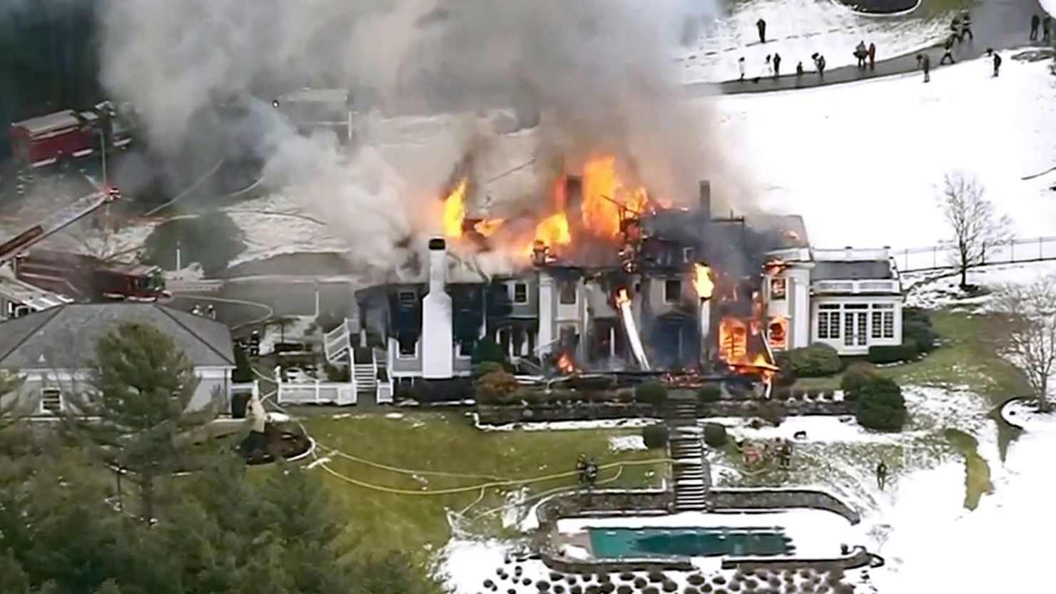 A still image from video provided by WCVB shows a mansion ablaze in Concord, Massachusetts, on December 27, 2019.