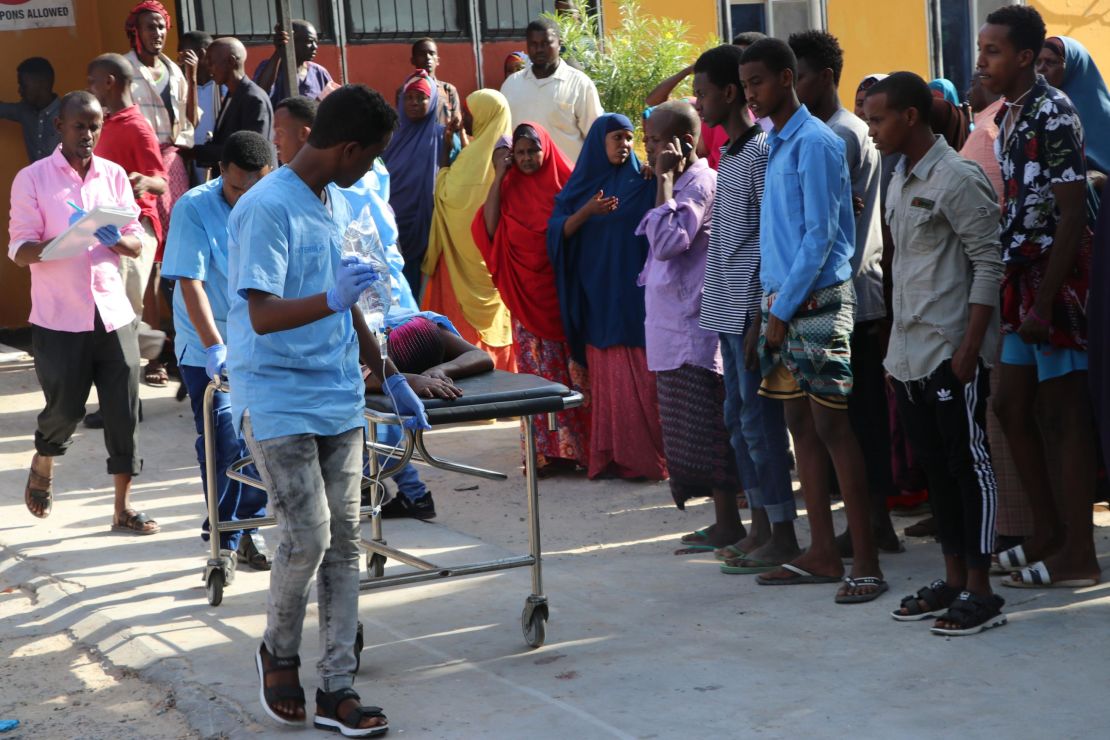 Nurses from Mogadishu's Madina Hospital push a wounded person on a stretcher.