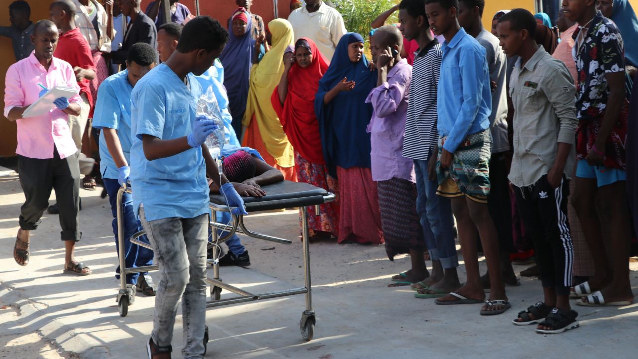 Nurses from Mogadishu's Madina Hospital push a wounded person on a stretcher.