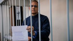 US-British Paul Whelan, a former US Marine accused of espionage and arrested in Russia in December 2018, holds a message as he stands inside a defendants' cage before a hearing to decide to extend his detention at the Lefortovo Court in Moscow on October 24, 2019. (Photo by Dimitar DILKOFF / AFP) (Photo by DIMITAR DILKOFF/AFP via Getty Images)