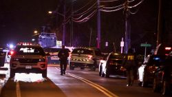 Authorities gather on a street in Monsey, N.Y., Sunday, Dec. 29, 2019, following a stabbing late Saturday during a Hanukkah celebration. A man attacked the celebration at a rabbi's home north of New York City late Saturday, stabbing and wounding several people before fleeing in a vehicle, police said. (AP Photo/Allyse Pulliam)