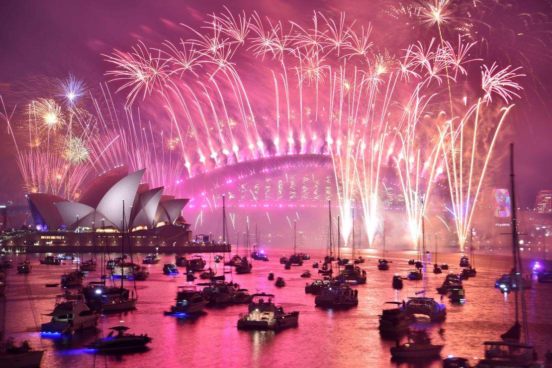 Fireworks erupt over Sydney's Harbour Bridge and Opera House during the fireworks show on January 1, 2019. 