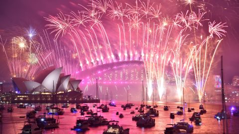 Fireworks erupt over Sydney's Harbour Bridge and Opera House during the fireworks show on January 1, 2019.