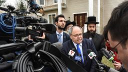MONSEY, NY - DECEMBER 29: Dani Dayan, Consul General of Israel in New York speaks to reporters outside the house of Rabbi Chaim Rottenberg on December 29, 2019 in Monsey, New York. Five people were injured in a knife attack during a Hanukkah party and a suspect, identified as Grafton E. Thomas, was later arrested in Harlem. (Photo by Stephanie Keith/Getty Images)