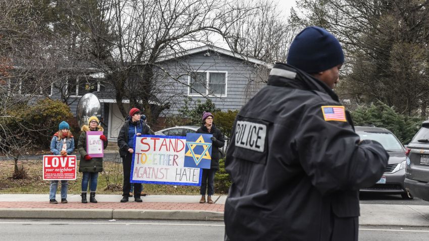 MONSEY, NY - DECEMBER 29: People hold signs of support near the house of Rabbi Chaim Rottenberg on December 29, 2019 in Monsey, New York. Five people were injured in a knife attack during a Hanukkah party and a suspect, identified as Grafton E. Thomas, was later arrested in Harlem. (Photo by Stephanie Keith/Getty Images)